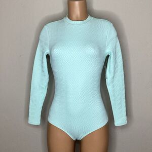 New. WET L.A. mint long sleeve rashguard. Medium. Retails $200